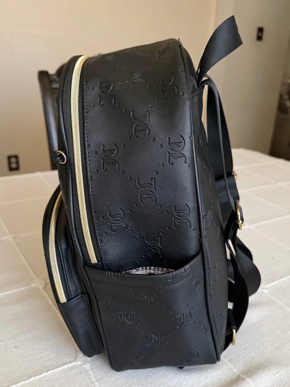 Juicy Couture Black Embossed Logo Backpack with Gold Hardware